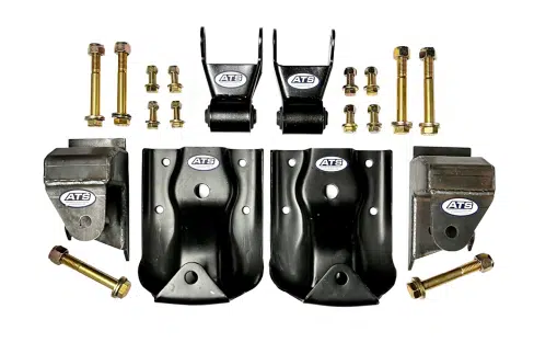 A collection of black metal automotive parts and gold bolts are arranged on a white background.